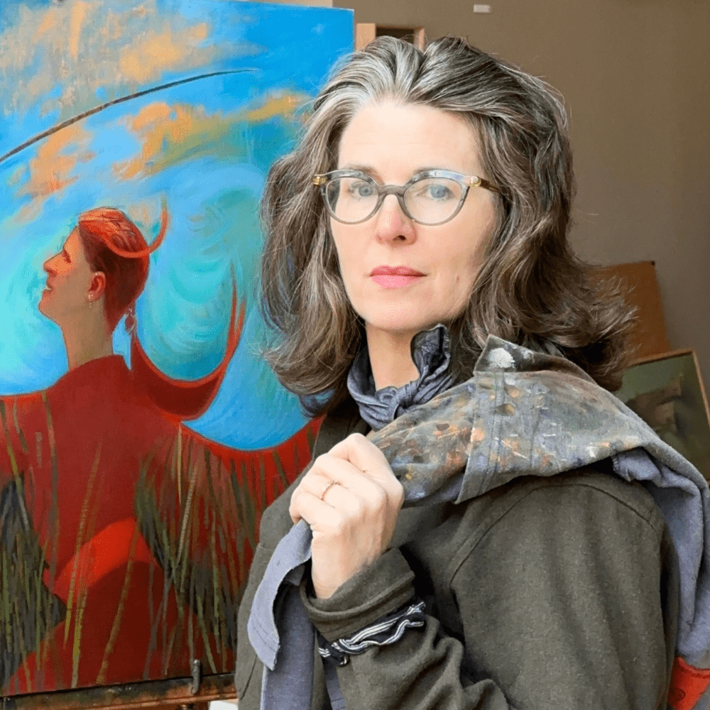Artist Nicole Alger standing in her studio beside one of her vibrant figurative paintings on an Artefex panel.