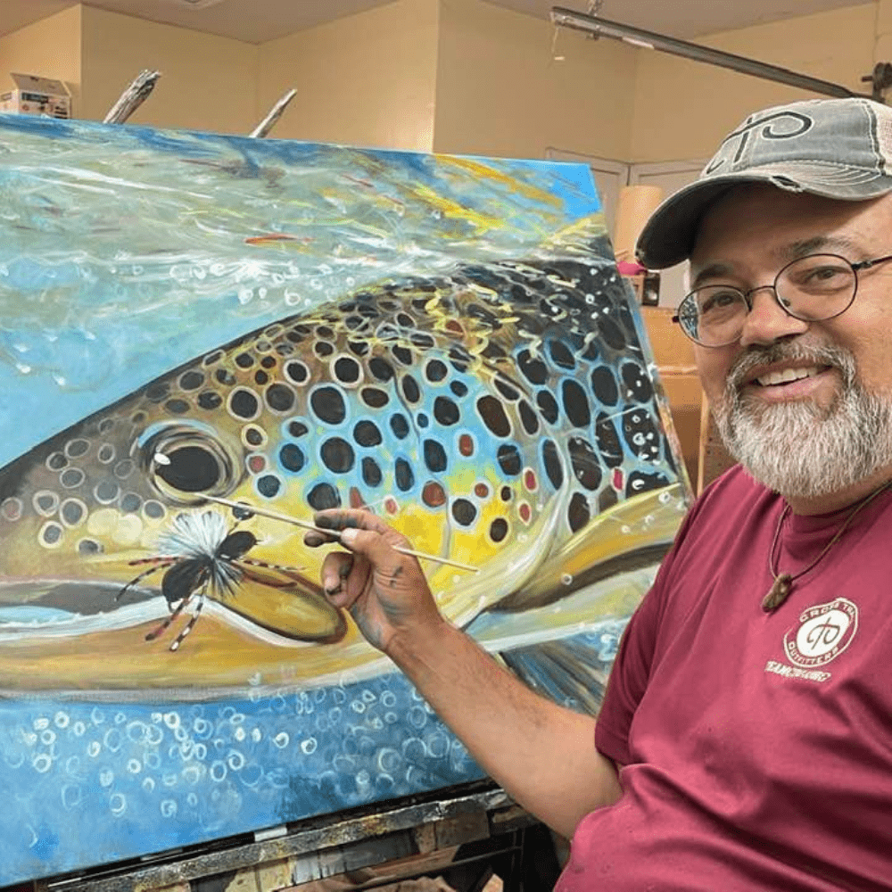 Duane Hada paints a detailed trout scene on a large Artefex all-in-panel in his studio during plein air workshop prep